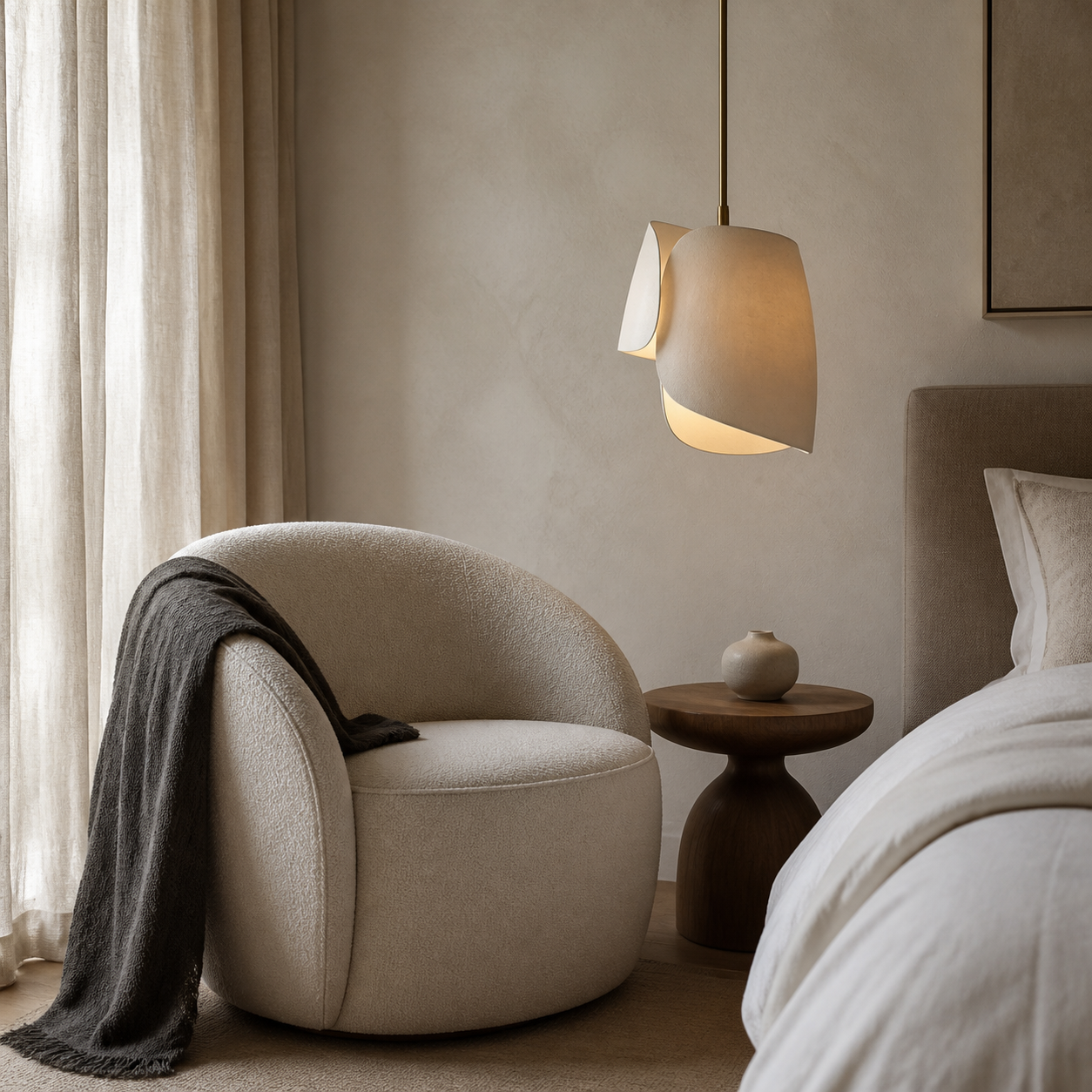 A bedroom with layered bedside lighting
